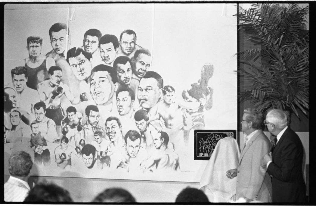 A mural is unveiled during a ceremony at the International Boxing Hall of Fame at the Dunes hot ...