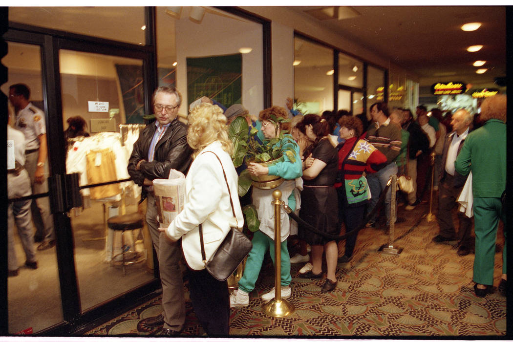 Shoppers line up to purchase Dunes towels, dishes and plants at discount prices on the hotel's ...