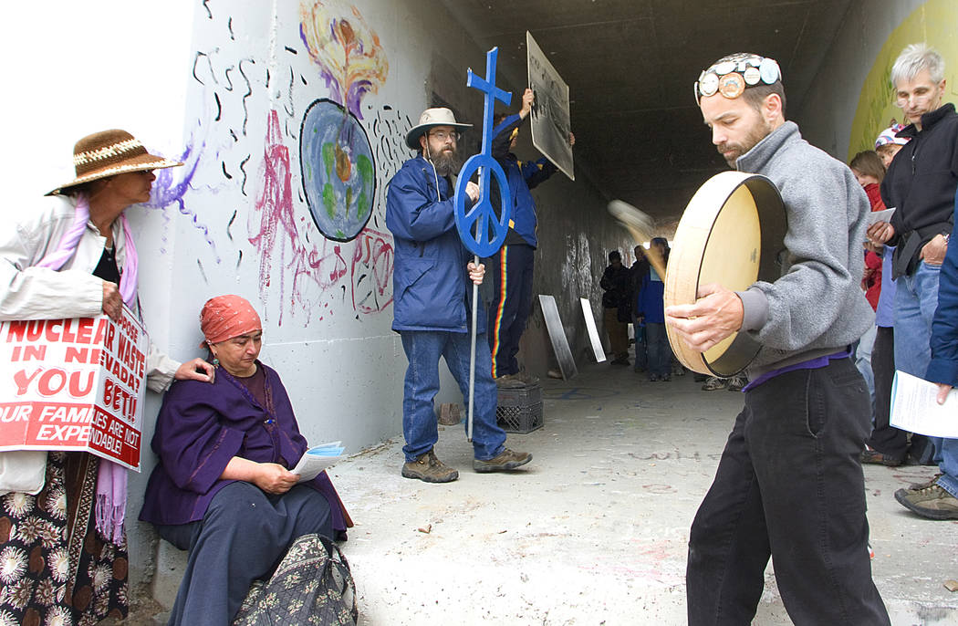 Eugene Bahn drums as the Rev. Paul Colbert of St. Luke Episcopal Church in Las Vegas, holds a ...