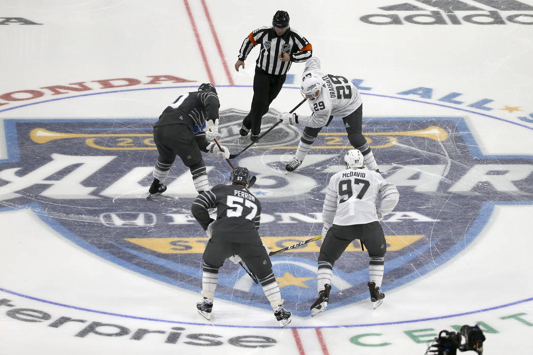 The puck is dropped for the start of the NHL All-Star hockey semifinal game between the Central ...