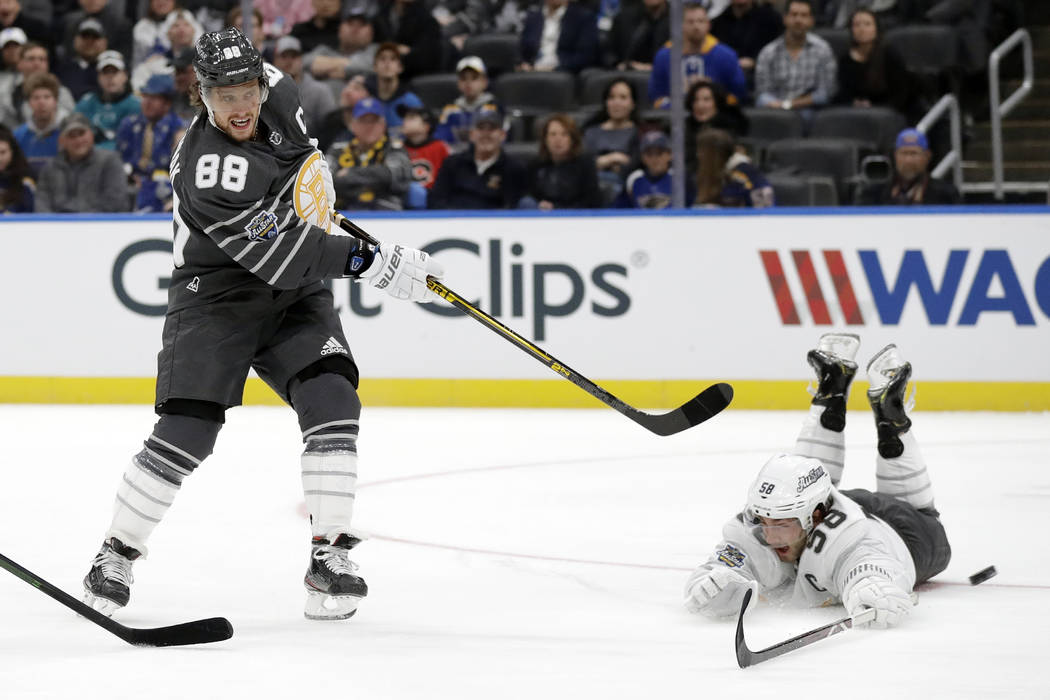 Boston Bruins forward David Pastrnak (88) scores a goal past Pittsburgh Penguins defender Kris ...