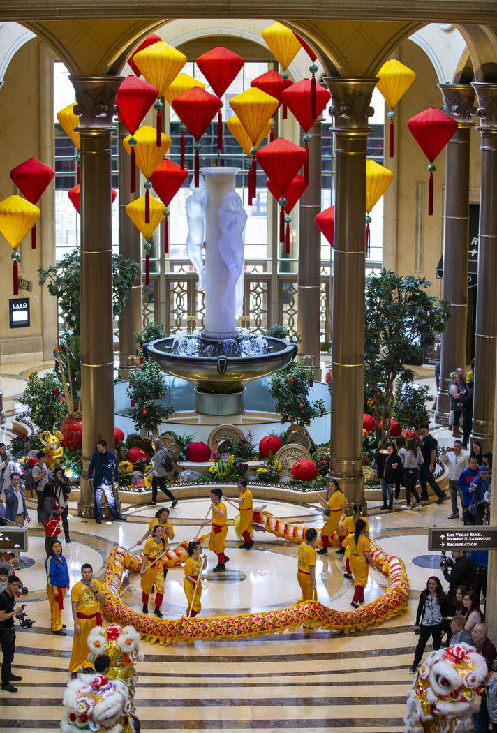 Dancers from the Yau Kung Moon dance troupe in San Francisco perform a dragon dance through the ...