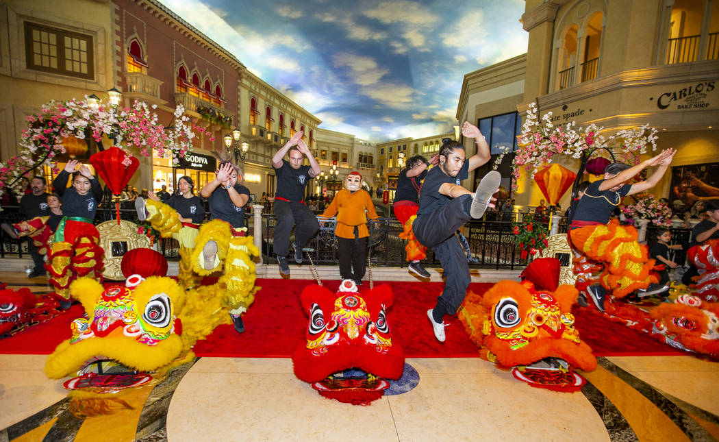 Members of the Lohan School of Shaolin warm up for a lion dance as the Grand Canal Shoppes cele ...