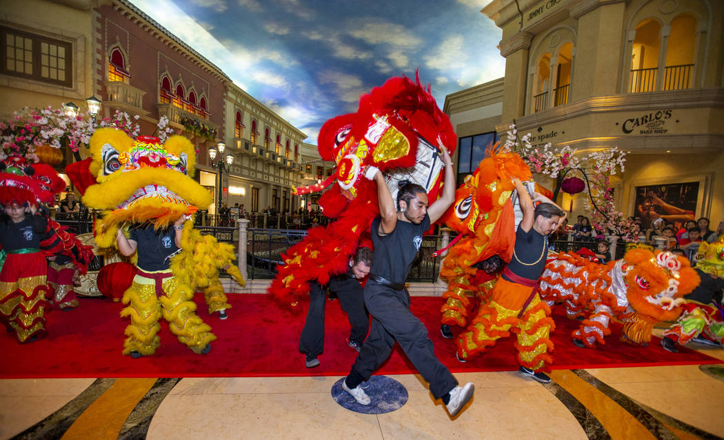 Members of the Lohan School of Shaolin warm up for a lion dance as the Grand Canal Shoppes cele ...