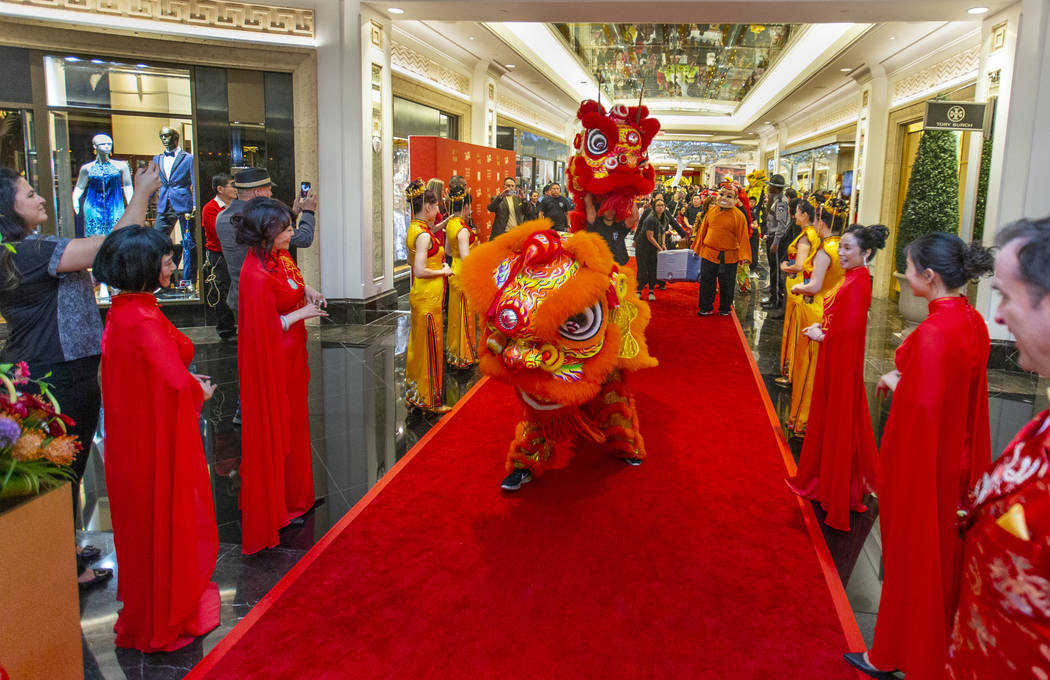 The Lohan School of Shaolin conduct a lion dance into a reception as the Grand Canal Shoppes ce ...