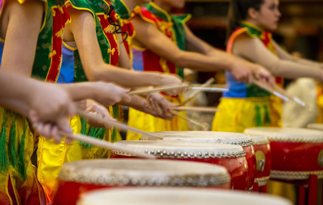 Members of the Li Ling Hong drum group perform at a reception as the Grand Canal Shoppes celebr ...