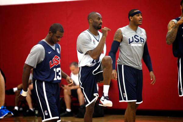 2012 USA Basketball Men's National Team player Kobe Bryant, center, stretches with teammates at ...
