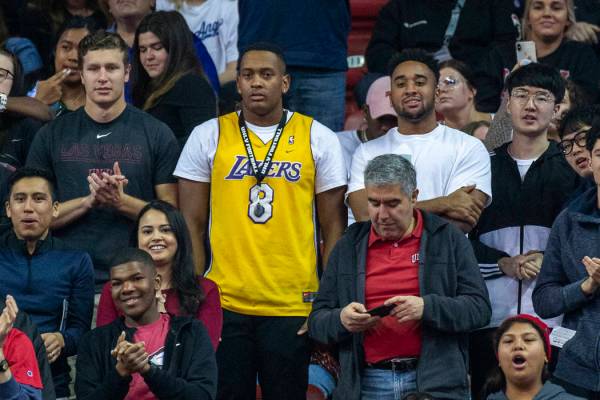 A fan wears a Kobe Bryant Lakers' jersey as he watches the UNLV Rebels battle the San Diego Sta ...