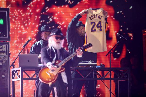 Joseph Simmons holds a jersey of the late Kobe Bryant at the 62nd annual Grammy Awards on Sunda ...
