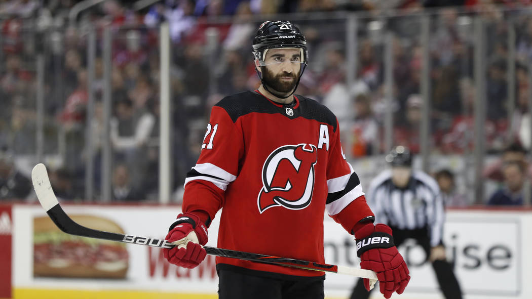 New Jersey Devils right wing Kyle Palmieri (21) before a face-off in the second period of an NH ...