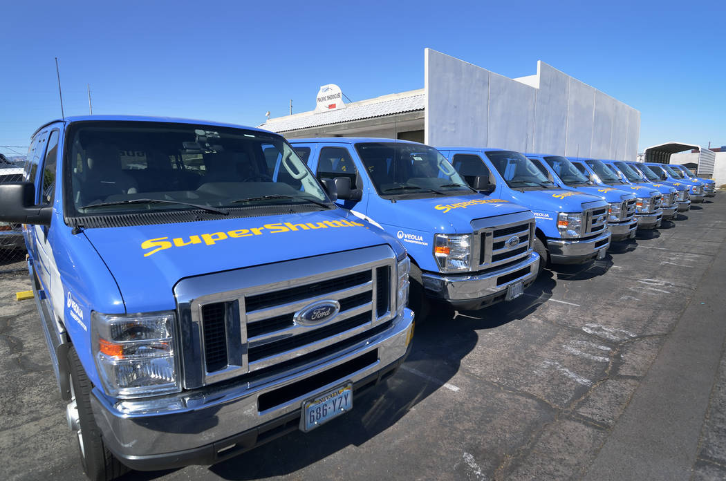 Some of the 15vehicles bought by SuperShuttle for its residential service are shown in the shut ...