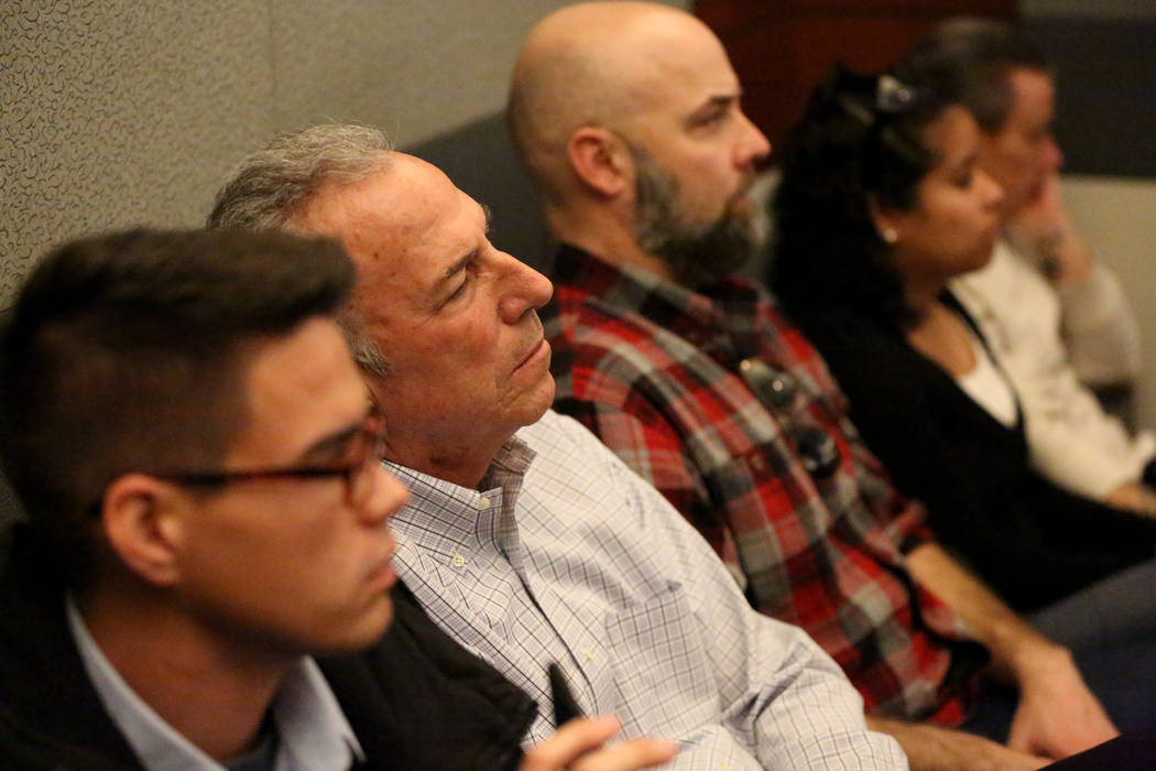 Clark County District Attorney Steve Wolfson, center, listens to testimony during the trial of ...
