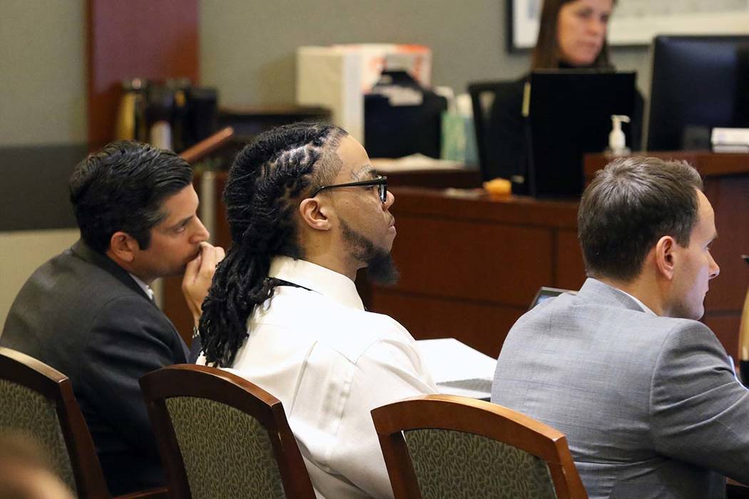 Ray Charles Brown, right, who faces the death penalty for fatally shooting Lee's Liquor clerk M ...
