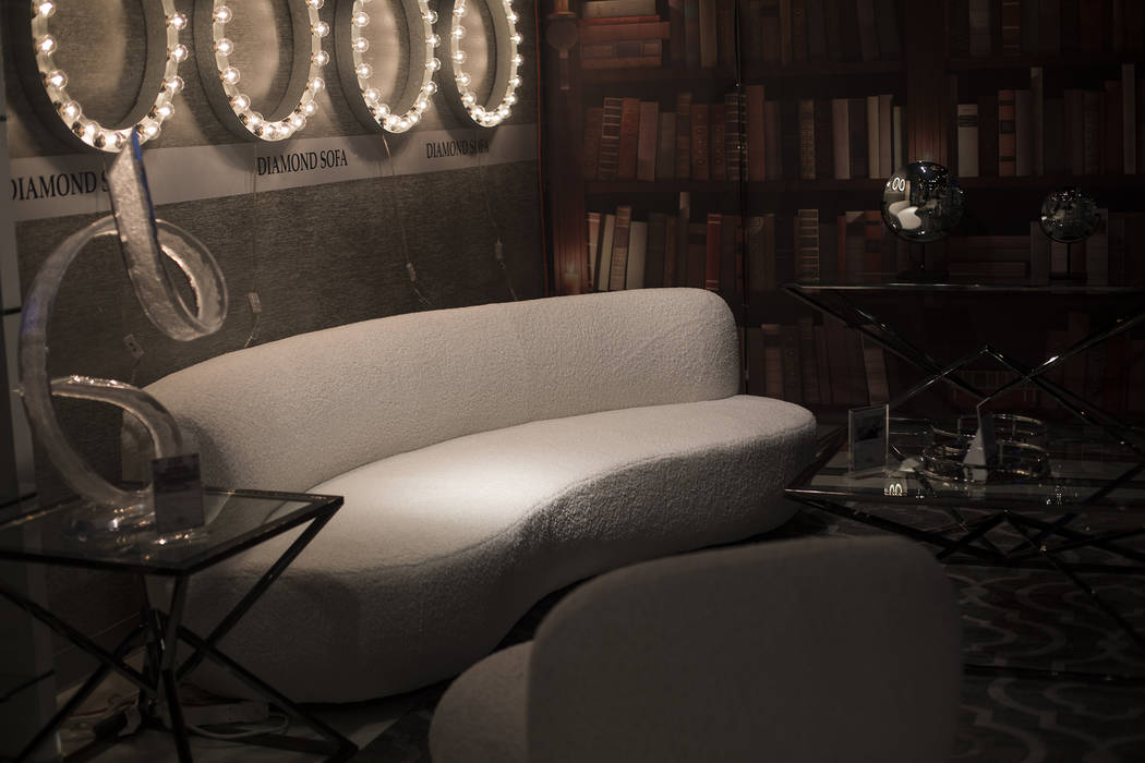 The textured neutrals of the sofa at the Diamond Sofa booth is a trend for the coming year at t ...