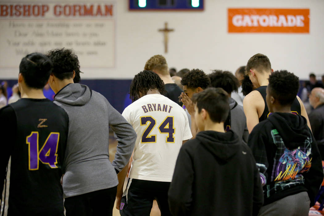 Bishop Gorman and Durango players, including Durango guard Keshon Gilbert wearing a Kobe Bryant ...