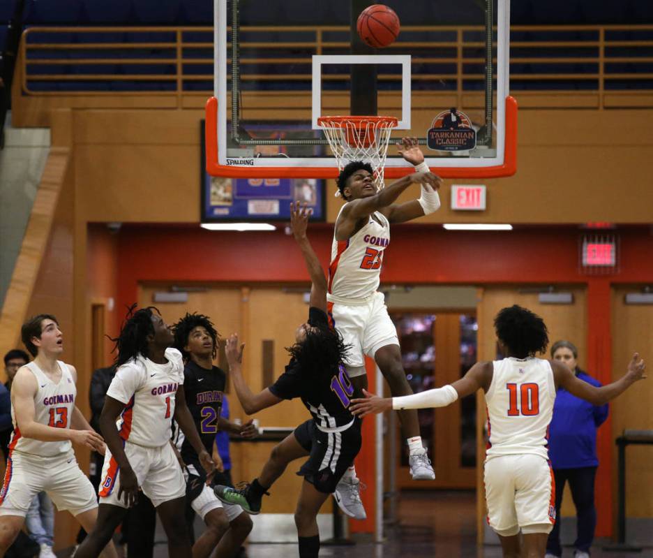 Bishop Gorman forward Mwani Wilkinson (23) blocks a shot by in the Durango guard Keshon Gilbert ...