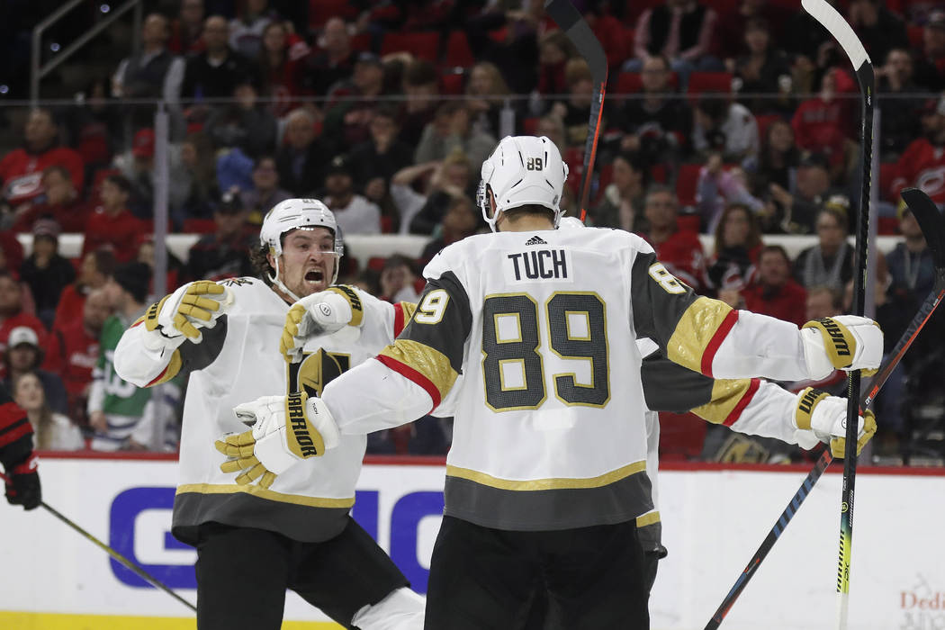 Vegas Golden Knights right wing Mark Stone reacts with right wing Alex Tuch (89) following Tuch ...