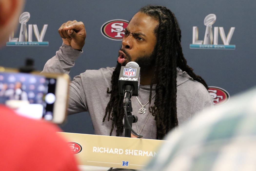 San Francisco 49ers cornerback Richard Sherman responds to questions during Super Bowl LIV medi ...