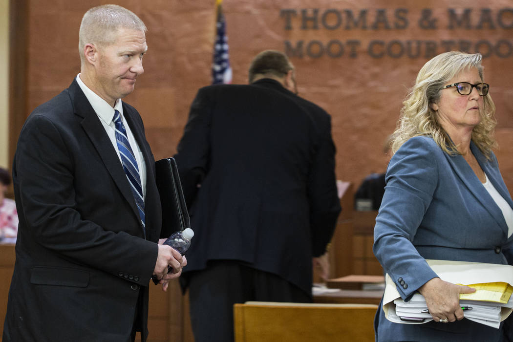 Former Henderson police officer Jared Spangler, left, and attorney Lisa Anderson leave the Thom ...
