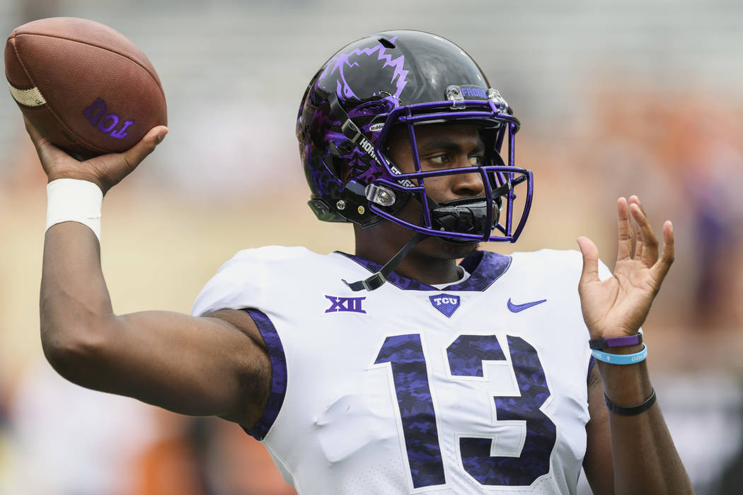 TCU quarterback Justin Rogers (13) warms up before a game against Longhorns. Saturday, Septembe ...