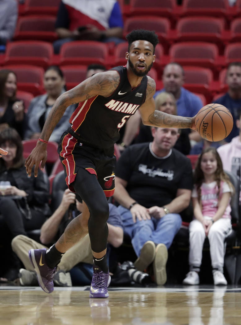 Miami Heat forward Derrick Jones Jr. dribbles the ball during the first half of an NBA basketba ...