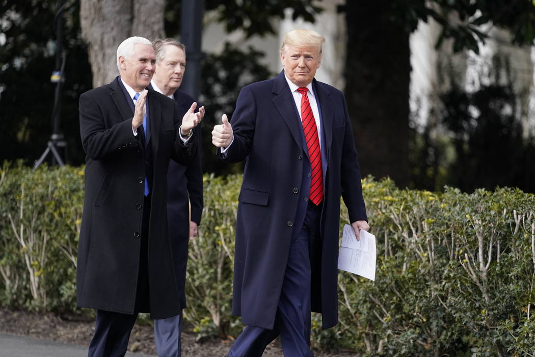President Donald Trump arrives at an event with Vice President Mike Pence and U.S. Trade Repres ...