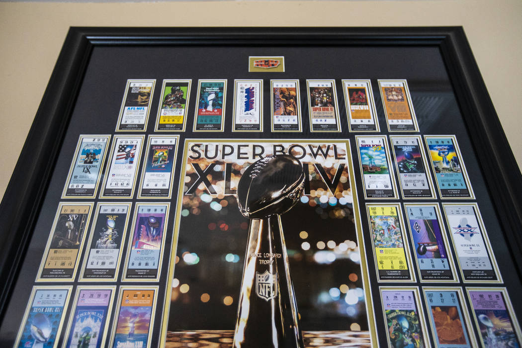 Framed Super Bowl tickets accumulated over a lifetime of covering the NFL championship game han ...