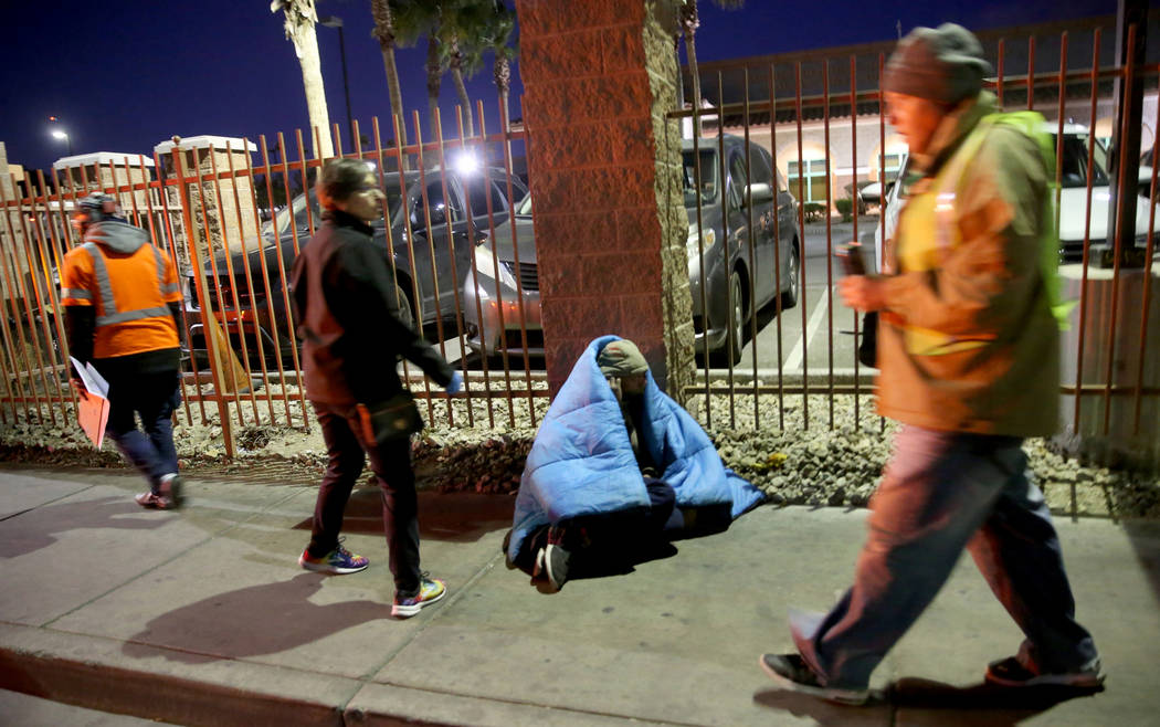 Homeless count volunteers on Las Vegas Boulevard near Foremaster Lane in downtown Las Vegas Wed ...