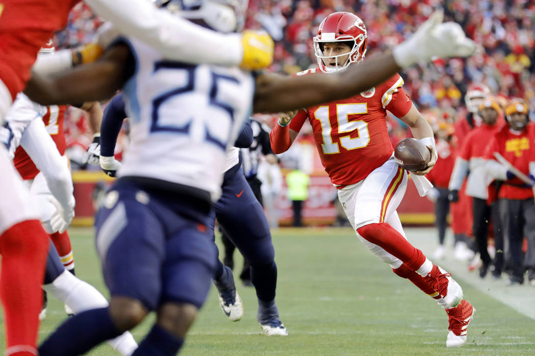 Kansas City Chiefs quarterback Patrick Mahomes (15) scrambles for a touchdown during an NFL, AF ...
