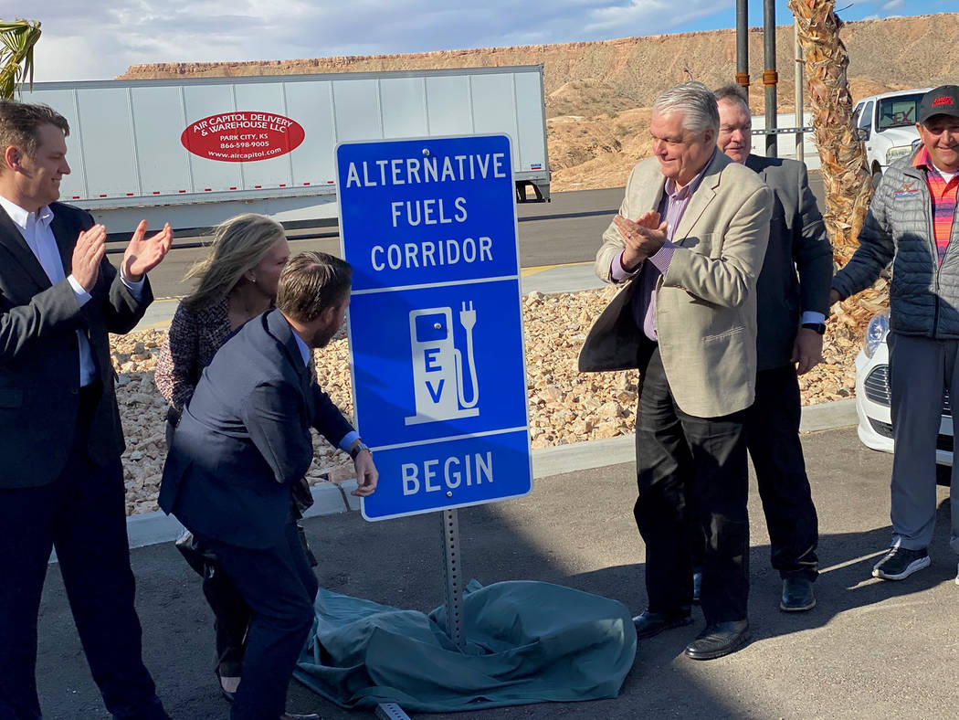 Gov. Steve Sisolak (third from right) and other dignitaries unveil Interstate 15 as an Electric ...