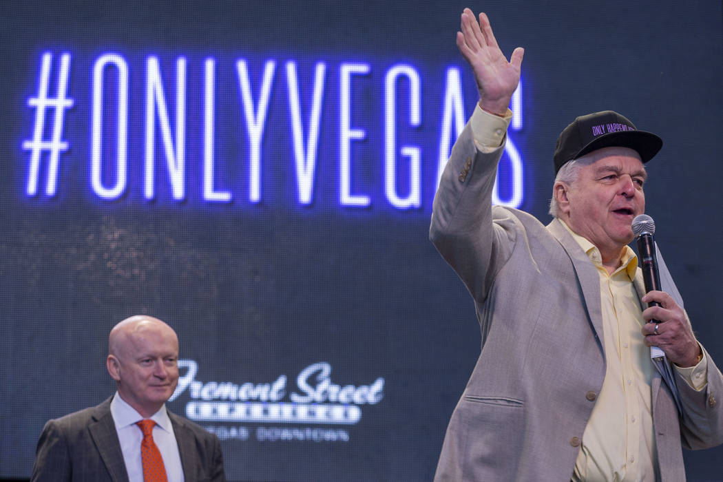 Patrick Hughes, president and CEO of the Fremont Street Experience, left, and Nevada Gov. Steve ...