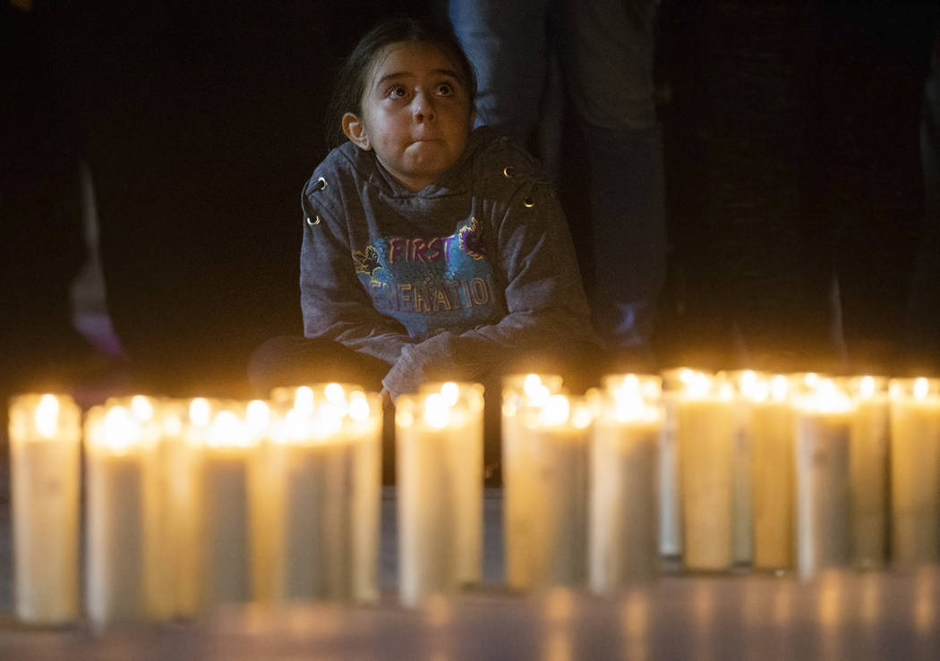 Attendees listen to stories about the impact Kobe Bryant had on his fans lives during a vigil f ...