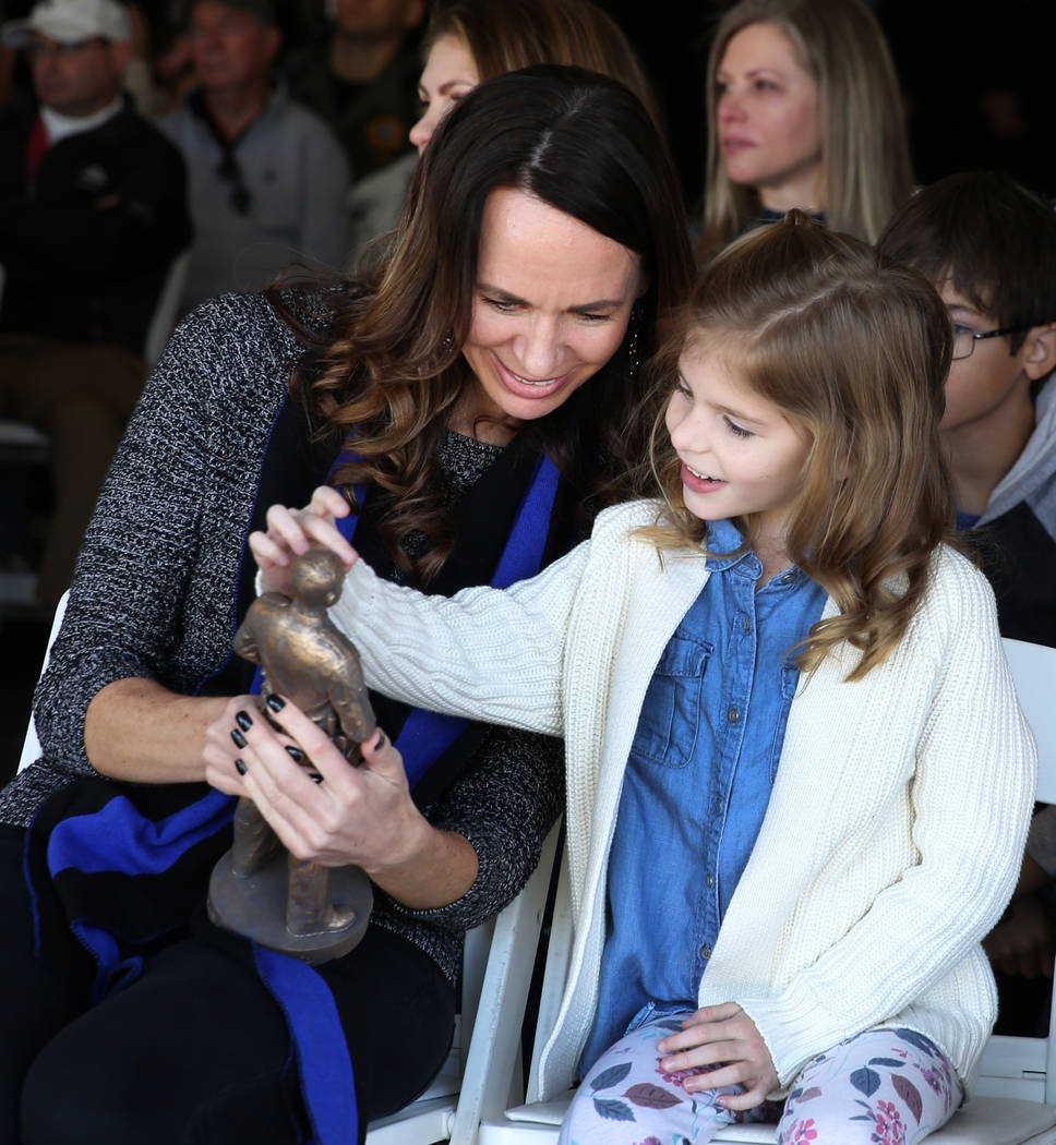 Officer Alyn Beck’s widow, Nicole Beck, left, and her daughter Katriann, 6, look at a replica ...