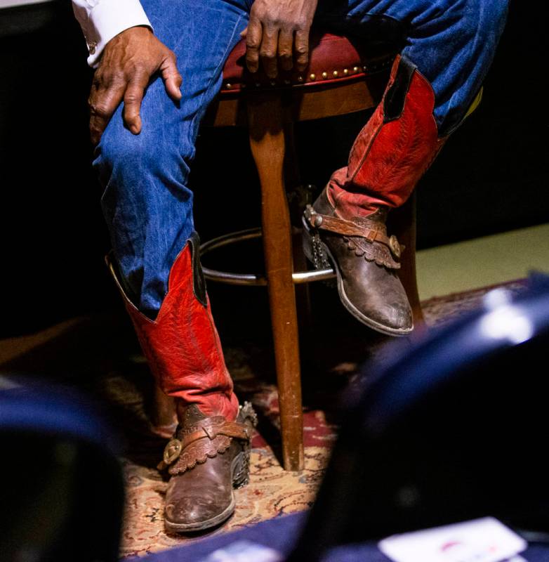 The boots of Pete Taylor, of Oakland, Calif., are seen as he talks about his experiences as a c ...