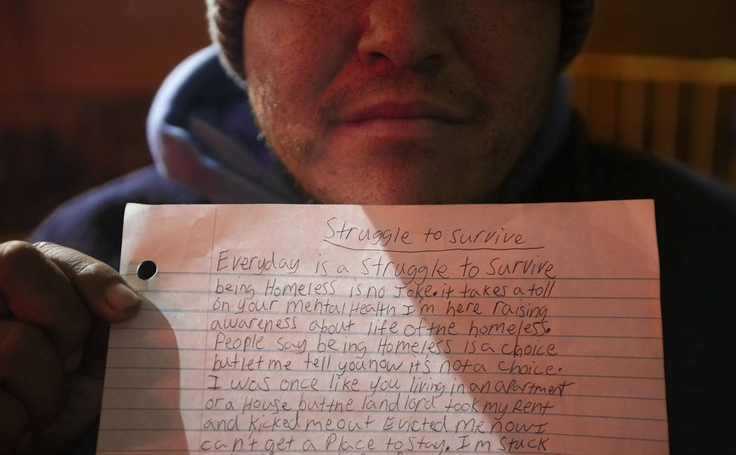 Patrick Wilkey holds a piece of paper chronicling his struggles living on the streets at the Co ...