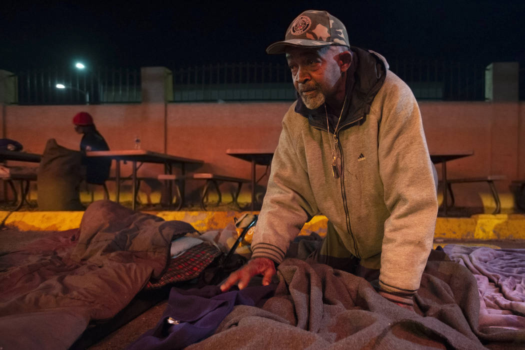Army veteran Jimmy Barfield prepares to sleep on a mat supplied by the Courtyard Homeless Resou ...