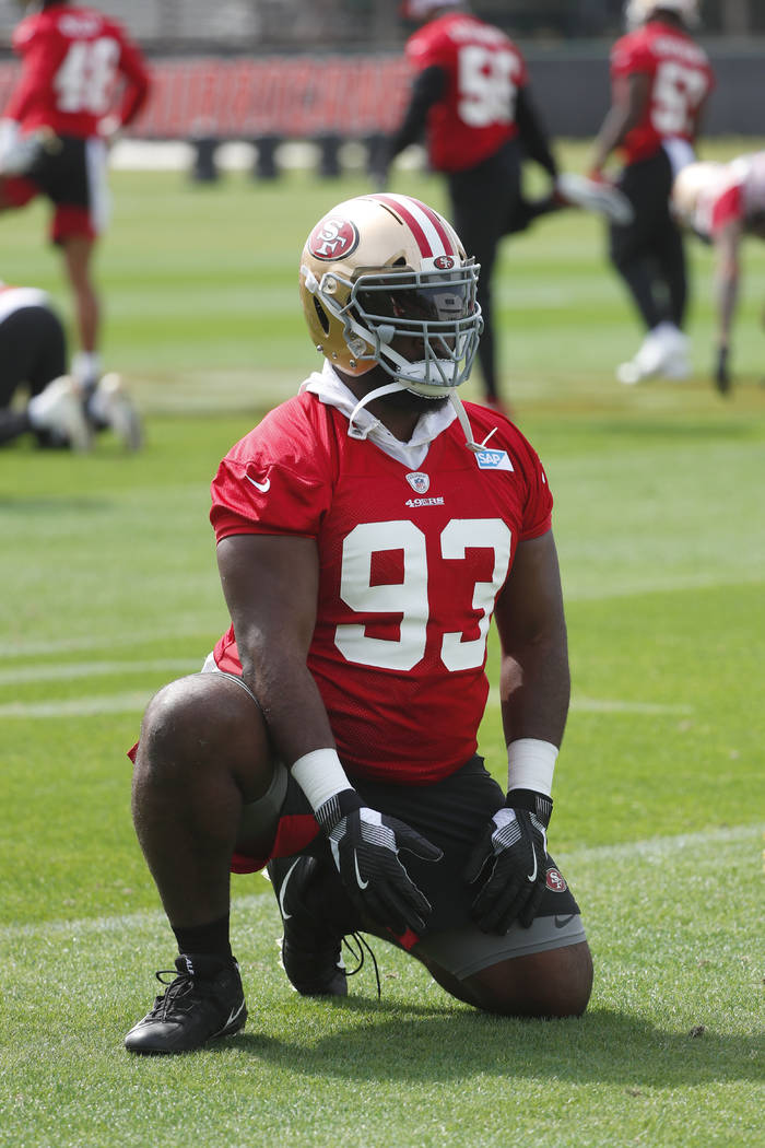 San Francisco 49ers defensive tackle Earl Mitchell stretches during practice for the NFL Super ...