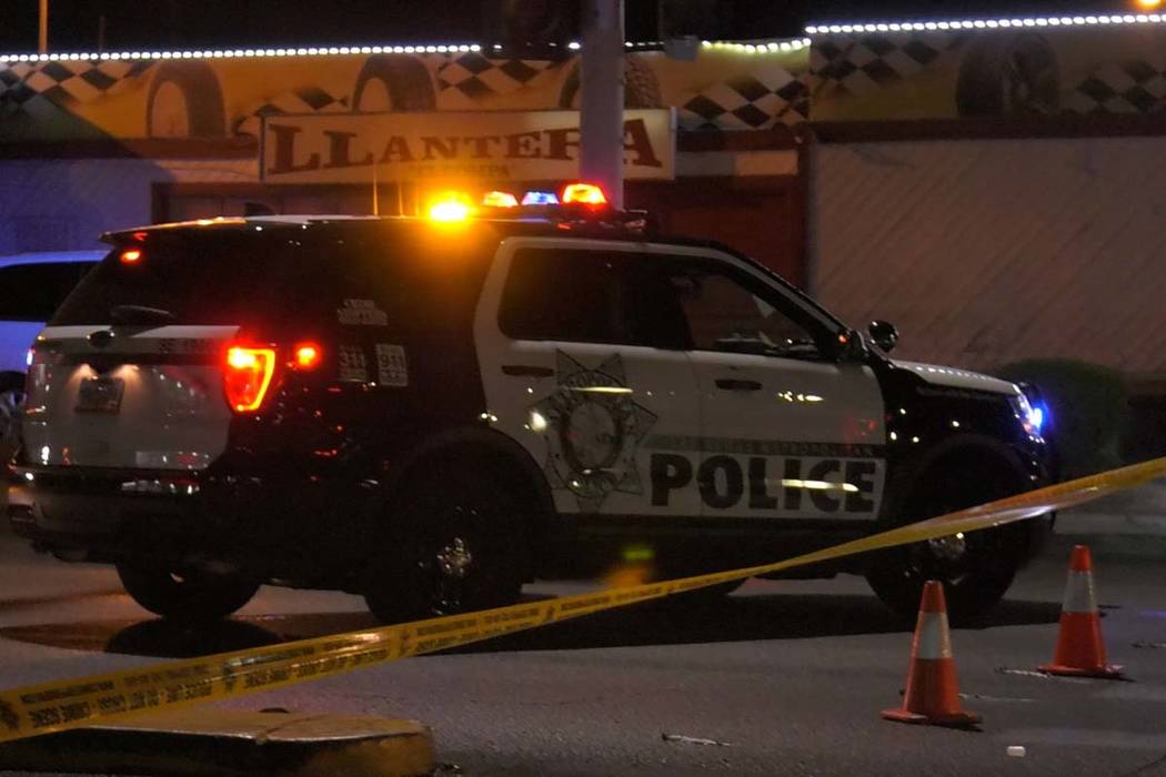 Las Vegas police investigate a body found in the intersection at North Lamb Boulevard and Stewa ...