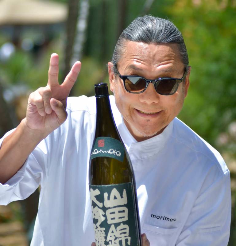 Chef Masaharu Morimoto is shown with a bottle of his sake during Picnic in the Park at the Park ...