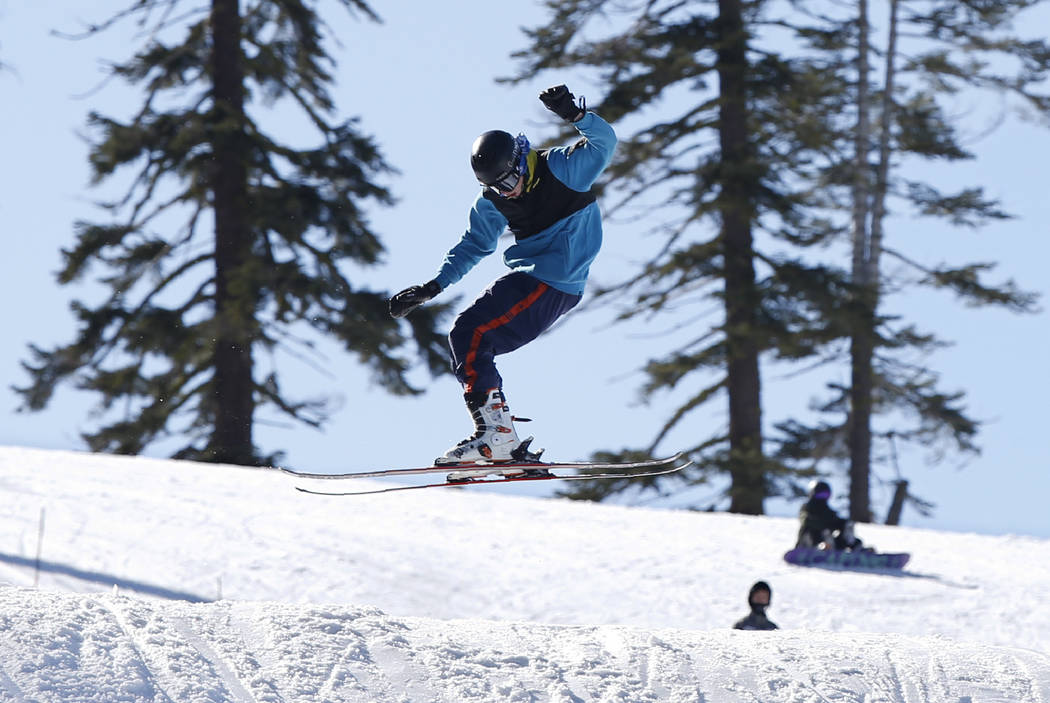 A skier makes a jump at the Sierra At Tahoe ski resort near Echo Summit , Calif., Thursday, Jan ...