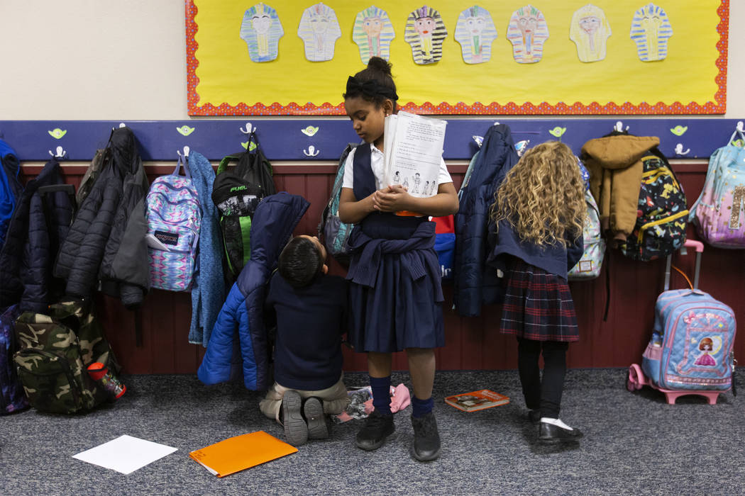 Students at American Preparatory Academy transition from recess to their reading group time on ...