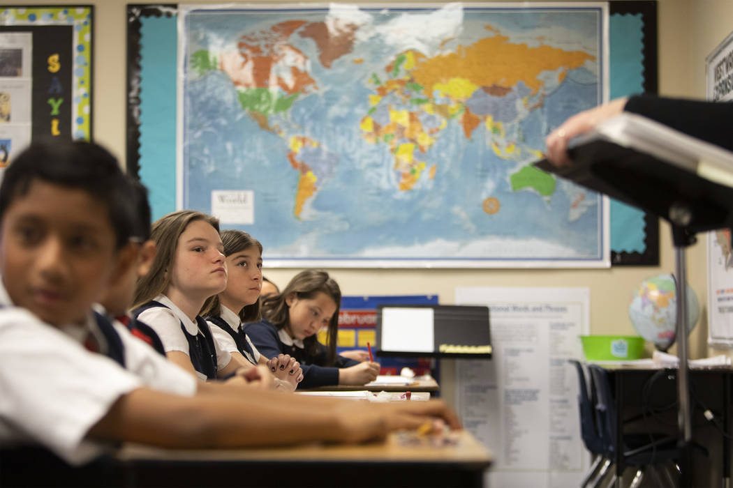 Fifth grade students listen to their teacher Kate de Jesus at American Preparatory Academy on T ...