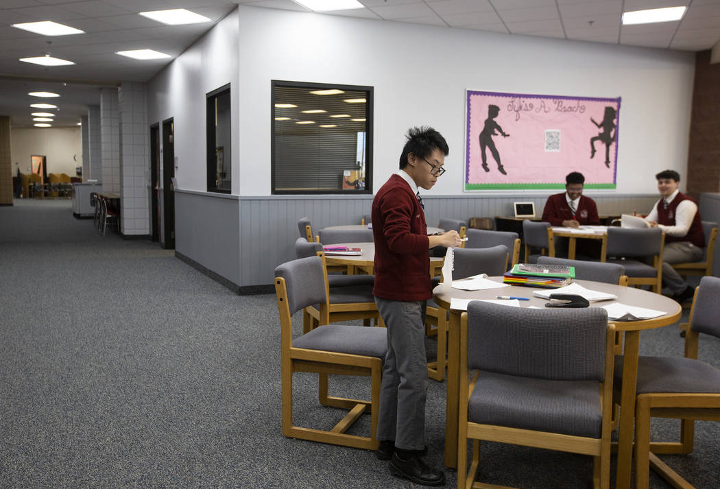 Quy Tran, a senior at American Preparatory Academy, studies a space designated for senior stude ...