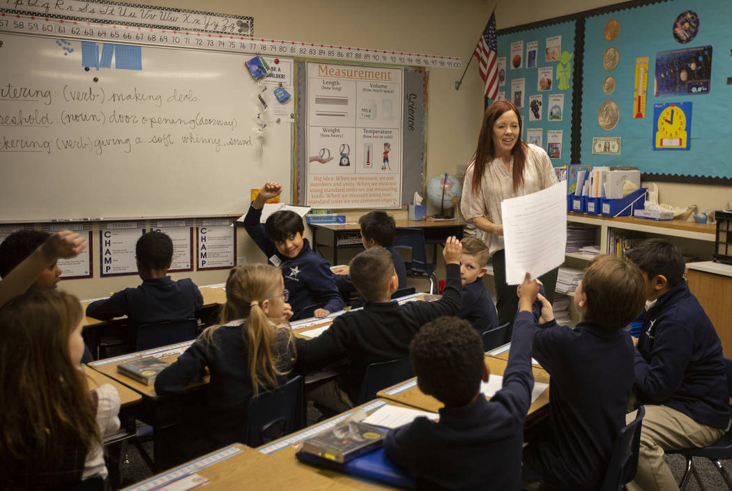 Nicole Doney begins a reading lesson for a group of first through third grade students at Ameri ...