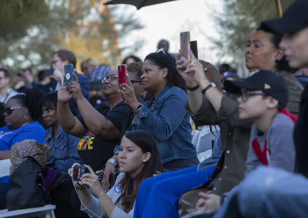 The audience at the Black History Month Festival records presidential candidate Joe Biden as he ...