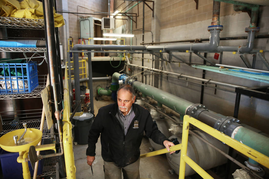 Maintenance tech Brad McClelland installs new acid tanks at Idlewild Pool on Monday, Jan. 6, 20 ...