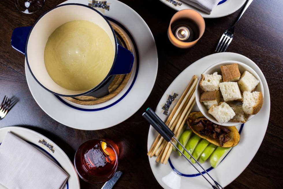 Cheese fondue with accompaniments. (Blue Ribbon)