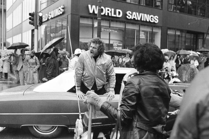 Big John Matuszak of the Super Bowl champion Raiders shouts at fans from his limousine during ...