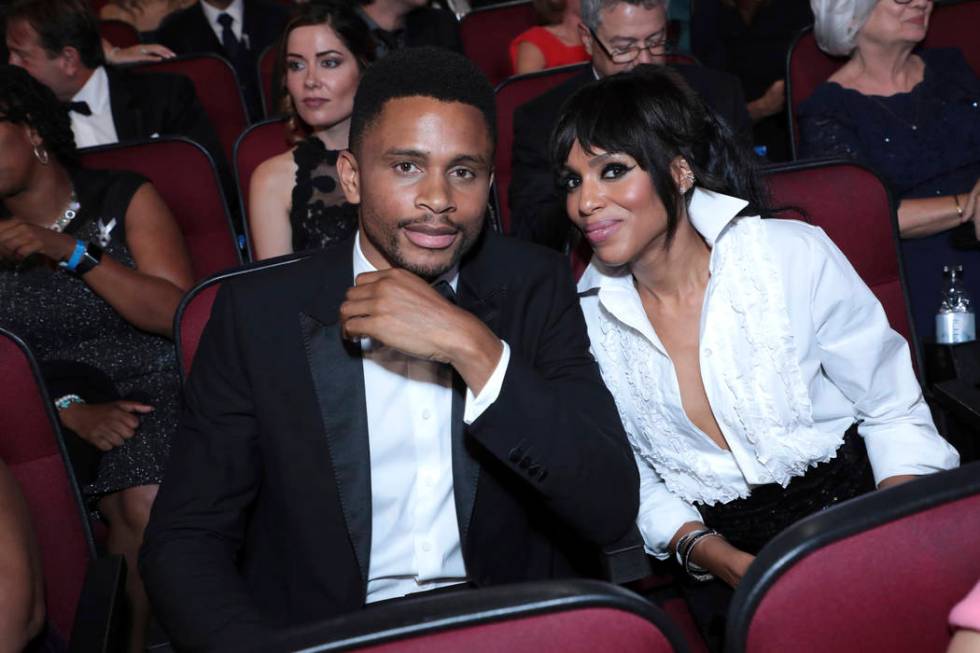 Nnamdi Asomugha, left, and Kerry Washington pose in the audience at the 71st Primetime Emmy Awa ...