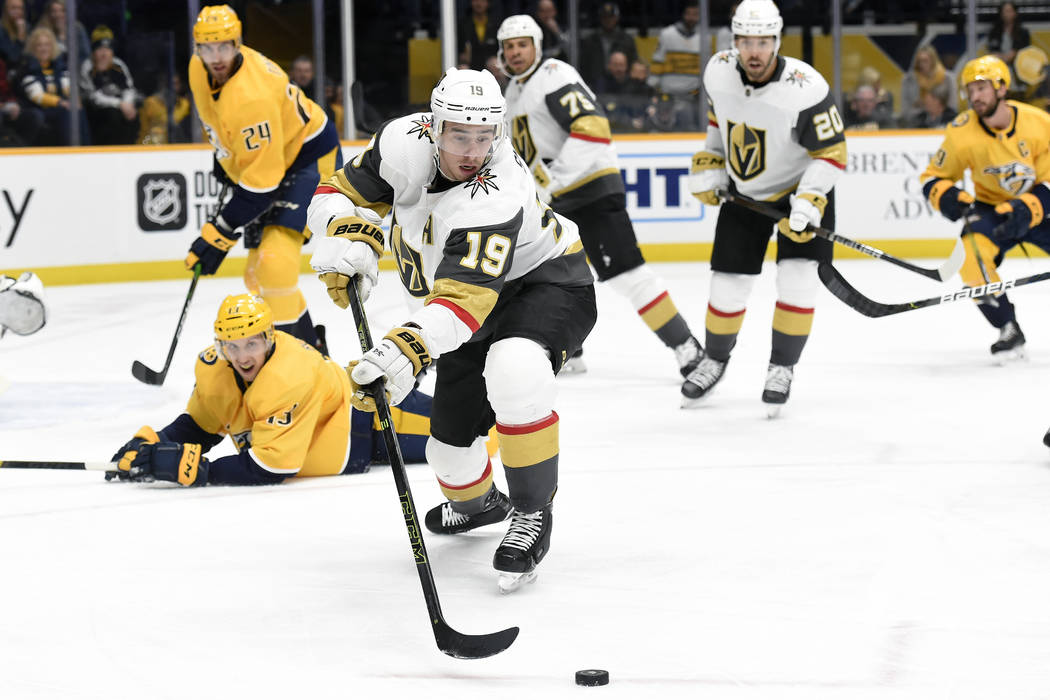 Vegas Golden Knights right wing Reilly Smith (19) moves the puck away from Nashville Predators ...